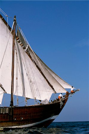 dhofar - S/Y Sanjeeda,a traditional kotiya dhow of the type that traded throughout the Indian Ocean,sailing off Mirbat on the Dhofari coast of Oman Stock Photo - Rights-Managed, Code: 862-03360241