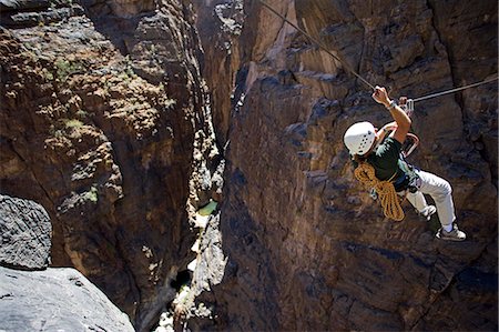 simsearch:862-03360160,k - Oman,Western Hajar Mountains,Snake Canyon. A newly installed Via Ferrata ( Iron Way ) enables climbers and adventure seekers to cross otherwise inaccessible canyons and explore its mountains only a few hours from Muscat. British climber Justin Halls shows the way. Stock Photo - Rights-Managed, Code: 862-03360298