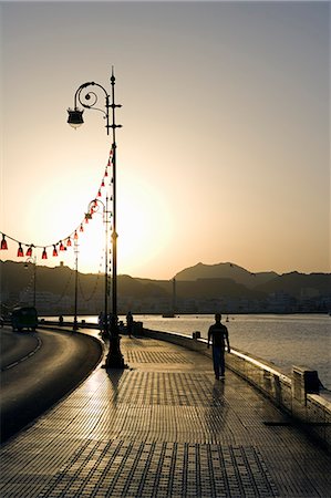 Oman,Muscat. A modern esplanade wraps around Muscat's harbour edge which is popular with local Omani for an evening stroll. Stock Photo - Rights-Managed, Code: 862-03360341