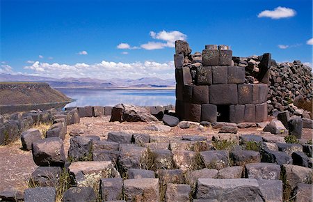 stonelocal people - Chullpa (Inca burial chamber) with Lake Umayo behind Stock Photo - Rights-Managed, Code: 862-03360456