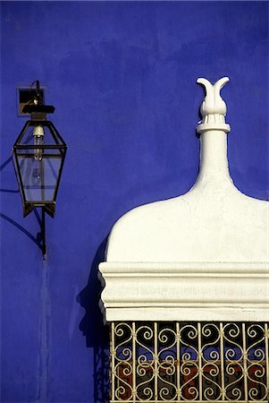 Wrought iron grillwork and pastel shades of a colonial mansion on the Plaza de Armas in Trujillo,Peru. The city in Peru's north,was founded by Francisco Pizarro in 1535. Stock Photo - Rights-Managed, Code: 862-03360507