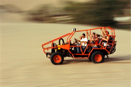simsearch:862-03360614,k - A dune buggy speeds tourists acoss through the sand dunes near Huacachina,in southern Peru. Stock Photo - Rights-Managed, Code: 862-03360612