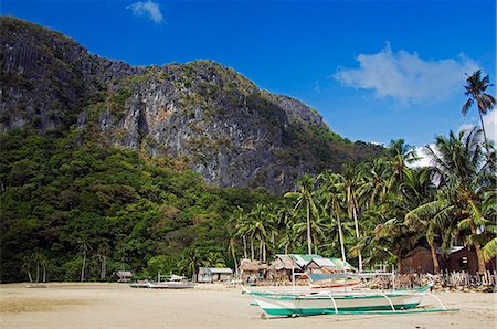 simsearch:841-03672325,k - Philippines,Palawan Province,El Nido Town,Bacuit Bay. Palm trees line the beach. Foto de stock - Con derechos protegidos, Código: 862-03360825