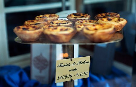 Pasteis de Belem a type of custard tart,in the window of the famous Antiga Confeitaria de Belem Stock Photo - Rights-Managed, Code: 862-03360855