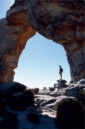 A trekker standing in the shadow of Wolfberg Arch Stock Photo - Rights-Managed, Code: 862-03361183