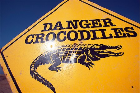 Beware of crocodile sign on St Lucia Beach. Stock Photo - Rights-Managed, Code: 862-03361222