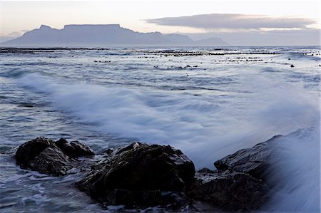 South Africa,Western Cape,Cape Town. Looking across to Melkbosstrand and Table Mountain at sunset. Stock Photo - Rights-Managed, Code: 862-03361243