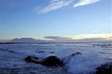 South Africa,Western Cape,Cape Town. Looking across to Melkbosstrand and Table Mountain at sunset. Stock Photo - Rights-Managed, Code: 862-03361265