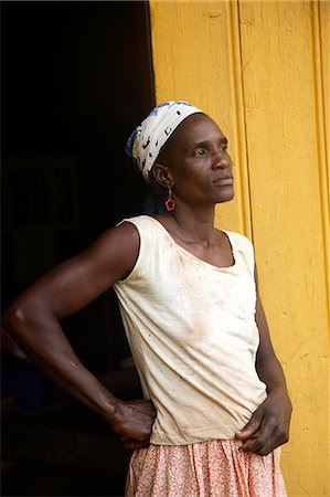 santomean - A Sao Tomense woman at the cocoa plant where she works in the small village of Agua Izé in Sao Tomé and Principé. Sao Tomé and Principé is Africa's second smallest country with a population of 193 000. It consists of two mountainous islands in the Gulf of New Guinea,straddling the equator,west of Gabon. Stock Photo - Rights-Managed, Code: 862-03361279