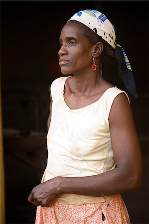 santomean - A Sao Tomense woman at the cocoa plant where she works in the small village of Agua Izé in Sao Tomé and Principé. Sao Tomé and Principé is Africa's second smallest country with a population of 193 000. It consists of two mountainous islands in the Gulf of New Guinea,straddling the equator,west of Gabon. Stock Photo - Rights-Managed, Code: 862-03361280