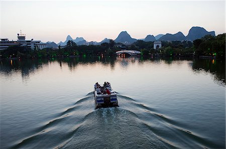 China,Guangxi Province,Guilin. A Boat on Banyan Lake Stock Photo - Rights-Managed, Code: 862-03436992