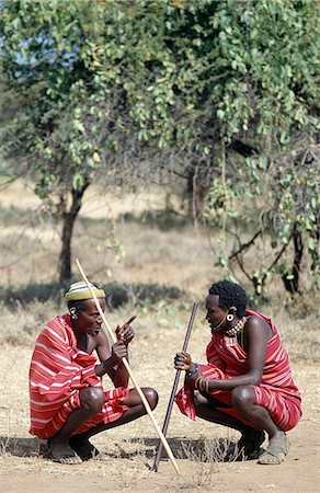 simsearch:862-08090669,k - Two Samburu elders deep in conversation. Men will never pass each other on a journey without stopping to chat. As such,information reaches even the remotest parts of the district surprisingly quickly. Stock Photo - Rights-Managed, Code: 862-03437156