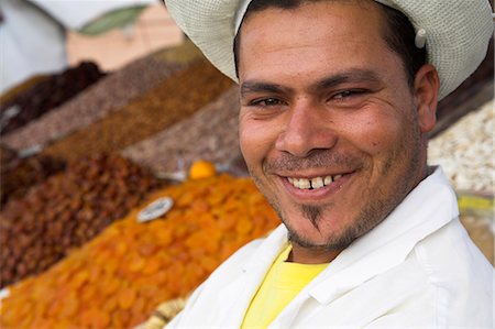 simsearch:862-03364710,k - A young man sells dried fruit from his stall in the Djemaa el Fna,Marrakech. Stock Photo - Rights-Managed, Code: 862-03437257