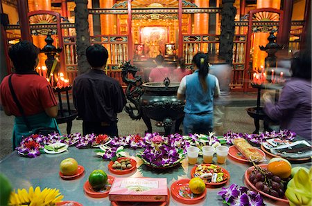 Longshan Temple worshippers and food and flower offerings Stock Photo - Rights-Managed, Code: 862-03437395