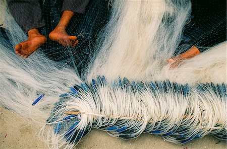 simsearch:862-03437713,k - Detail der Füße genutzt, um die Fischernetze reparieren Stockbilder - Lizenzpflichtiges, Bildnummer: 862-03437700