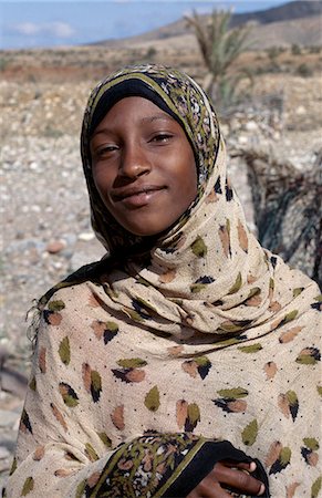 An attractively dressed Muslim girl in the foothills of the Homhill Mountains. Stock Photo - Rights-Managed, Code: 862-03437911