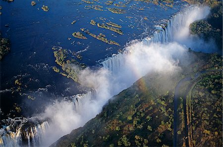 simsearch:862-03438038,k - Zambia,Victoria Falls. Aerial view of the Zambezi River as it plummets over the Victoria Falls,which span the border between Zambia and Zimbabwe Stock Photo - Rights-Managed, Code: 862-03438011