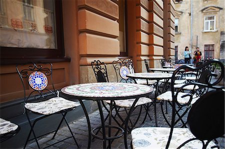 Tables at outdoor cafe, Lviv, Ukraine Stock Photo - Rights-Managed, Code: 862-03714076