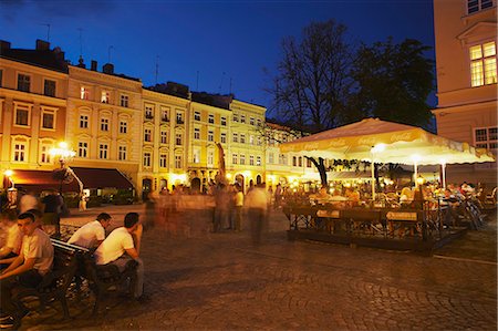 Outdoor cafes in Market Square (Ploscha Rynok) at dusk, Lviv, Ukraine Stock Photo - Rights-Managed, Code: 862-03714084