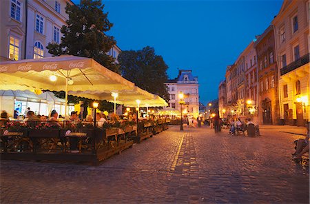 Outdoor cafes in Market Square (Ploscha Rynok) at dusk, Lviv, Ukraine Stock Photo - Rights-Managed, Code: 862-03714081