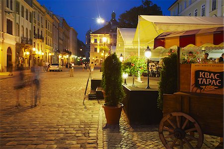 Outdoor cafes in Market Square (Ploscha Rynok) at dusk, Lviv, Ukraine Stock Photo - Rights-Managed, Code: 862-03714082