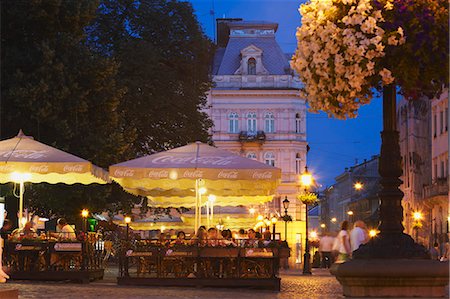 Outdoor cafes in Market Square (Ploscha Rynok) at dusk, Lviv, Ukraine Stock Photo - Rights-Managed, Code: 862-03714110