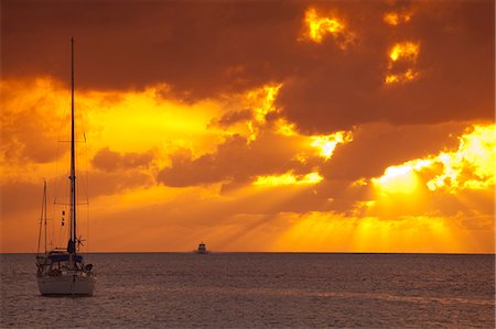 Exhumas, Bahamas. Sailboats at anchor in the Caribbean against a dramatic sky Stock Photo - Rights-Managed, Code: 862-03710351