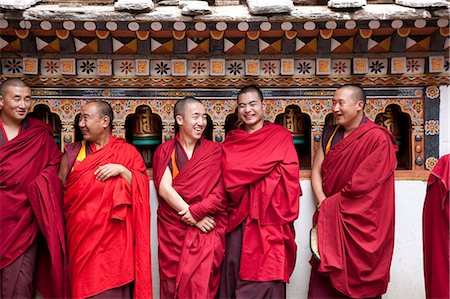 Monks in the Bhuddist temple or Dzong in Paro Bhutan Stock Photo - Rights-Managed, Code: 862-03710389