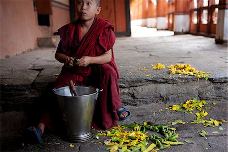 photos of young monks - A young boy peeling vegetables in the dzong or monastery in Paro, Bhutan Stock Photo - Rights-Managed, Code: 862-03710394