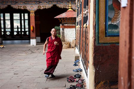 Monks in the Bhuddist temple or Dzong in Paro, Bhutan Stock Photo - Rights-Managed, Code: 862-03710391