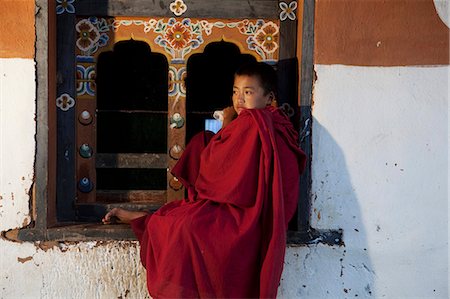 A novice monk near Wangdue Phodrang in Bhutan Stock Photo - Rights-Managed, Code: 862-03710542