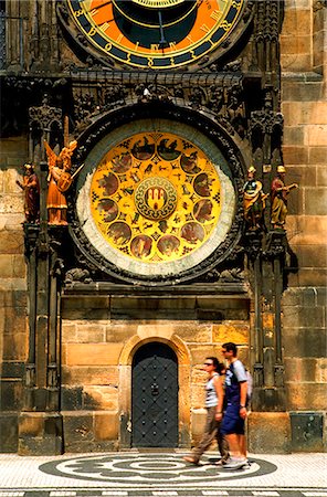 prague clock - Czech Republic, Prague; A couple walking beneath the Town Hall in Stare Mesto Stock Photo - Rights-Managed, Code: 862-03710828