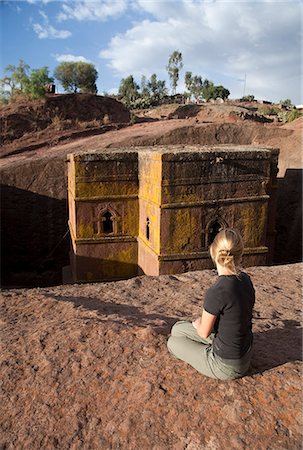 simsearch:862-03354001,k - Ethiopia, Lalibela, Bet Giyorgis. A tourist gazes at the rock-hewn church of Bet Giyorgis. Stock Photo - Rights-Managed, Code: 862-03711130