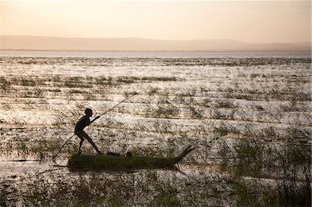 simsearch:862-03354001,k - Ethiopia, Lake Awassa. A young boy punts a traditional reed Tankwa through the reeds. Stock Photo - Rights-Managed, Code: 862-03711173