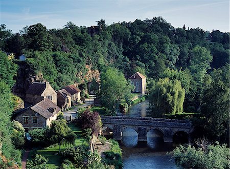 France,Normandy,Saint-Ceneri-le-Gerei. The Village & 'Le Sarthe' River. The village was founded by an Italian Hermit,Saint Ceneri,and is situated in the Mancelles Alps.A member of 'Les Plus Beaux Villages de France',the village attracted many 19th Century painters such as Corot & Courbet. Stock Photo - Rights-Managed, Code: 862-03711233