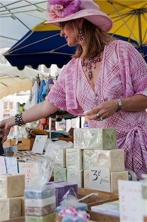simsearch:862-03711340,k - A woman in period costume selling home made soaps in the market in St Remy France Stock Photo - Rights-Managed, Code: 862-03711383
