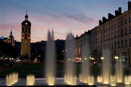 simsearch:862-03711335,k - Sunset in front of the lit fountains at the Place Anotonin Poncet in Lyon France Stock Photo - Rights-Managed, Code: 862-03711410