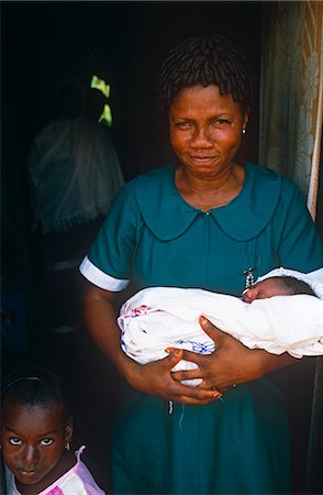 Ghana,Volta Region,Hohoe. Midwife nurse with a baby. Foto de stock - Con derechos protegidos, Código: 862-03711620