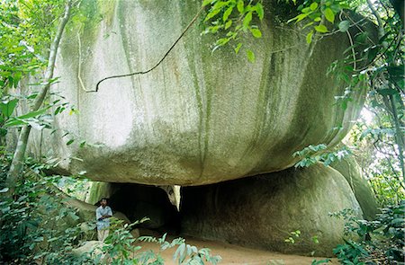 shrines in central region of ghana - Ghana,Central region,Wassa Domama. The sacred rock shrine at Wassa Domama has several impressive boulders which may be climbed using vines. Stock Photo - Rights-Managed, Code: 862-03711634