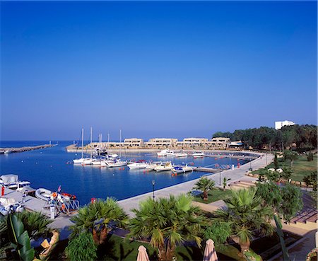 simsearch:862-03711658,k - The marina with the Asterias Suites in the background Stock Photo - Rights-Managed, Code: 862-03711659