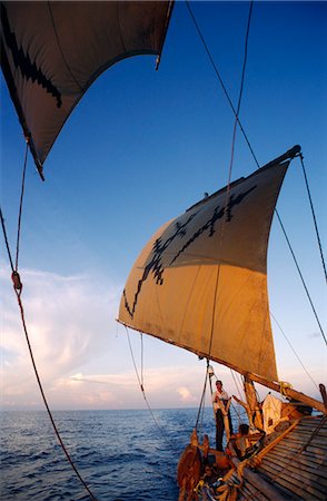 dhow boat - Indonesia,Sulawesi. Sailing through the Indonesian Archipelago,south of Sulawesi in a traditional Dhow. Stock Photo - Rights-Managed, Code: 862-03711831