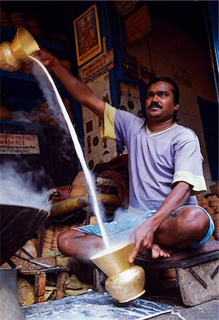 Preparing sweet milk in a stall on the streets of Barabazaar in North Kolkata Stock Photo - Rights-Managed, Code: 862-03712019