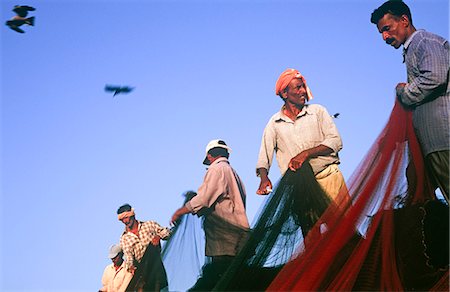 Fishermen pulling in their net, Malpe, near Udupi, State of Karnataka, South India Stock Photo - Rights-Managed, Code: 862-03712067