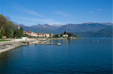 queen victoria - West side of Lake Maggiore showing snow capped mountains and the town of Baveno. Queen Victoria stayed here at the Villa Clara. Stock Photo - Rights-Managed, Code: 862-03712167