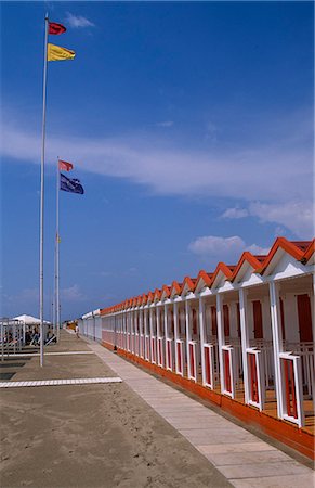 flag pole row - Beach huts and walkway at this Tuscan seaside resort Stock Photo - Rights-Managed, Code: 862-03712199