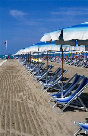 simsearch:862-03711658,k - Deck chairs and umbrellas on the beach Stock Photo - Rights-Managed, Code: 862-03712200