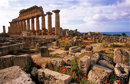 Italy,Sicily,Trapani. Selinunte is an abandoned ancient Greek city,with ruins of an acropolis and numerous temples. The city was founded in the seventh century BC,and effectively destroyed in 409 BC. Selinunte is located in the southwest coast of Sicily in the province of Trapani,close to the border with Agrigento province. Stock Photo - Rights-Managed, Code: 862-03712376