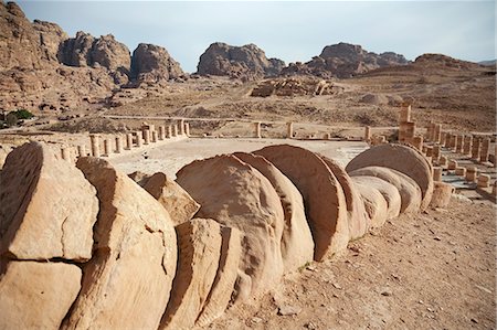 simsearch:862-08273501,k - Jordan, Petra. An ancient toppled Roman column, with the archeological marvels of Petra in the background. Stock Photo - Rights-Managed, Code: 862-03712598