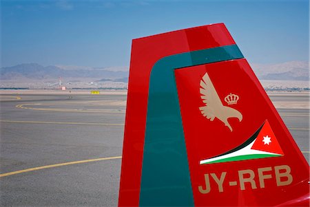 Jordan, Aqaba, King Hussein International Airport. Tail fin of Royal Jordanian Falcon display team. Fotografie stock - Rights-Managed, Codice: 862-03712599