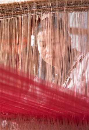 Woman weaving on loom, Luang Prabang, Laos Stock Photo - Rights-Managed, Code: 862-03712632